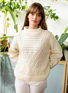 Cabled sweater with textured panel